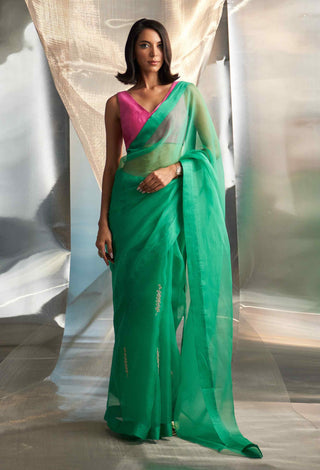 Lush green saree with pink blouse