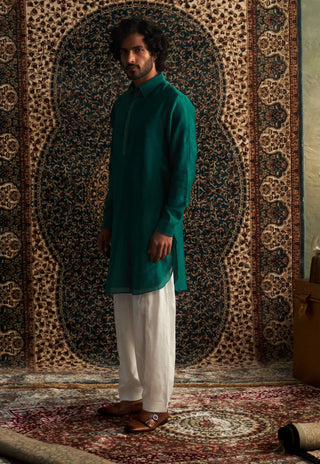 Emerald green pathani kurta and white salwar