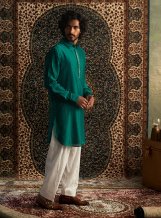 Emerald green pathani kurta and white salwar