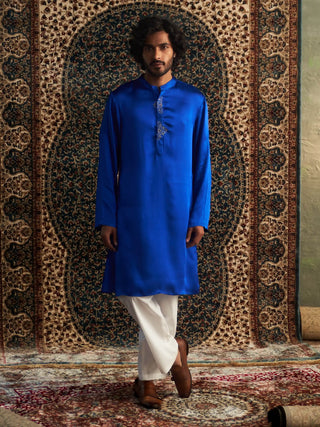 Blue long kurta and white straight trousers