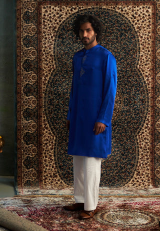 Blue long kurta and white straight trousers