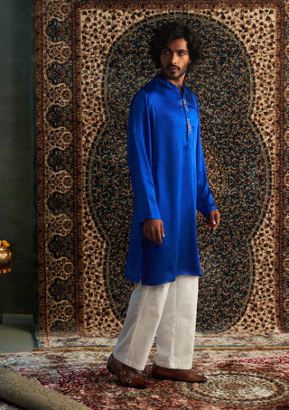 Blue long kurta and white straight trousers