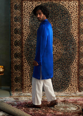 Blue long kurta and white straight trousers