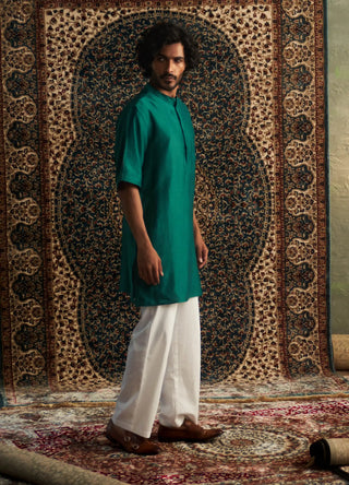 Emerald green kurta and white pyjamas