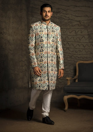 Cream printed sherwani and churidar