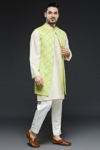 Ivory kurta and slim pant set paired with bright green long open jacket