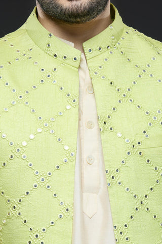 Ivory kurta and slim pant set paired with bright green long open jacket