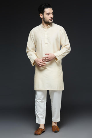 Ivory kurta and slim pant set paired with bright green long open jacket