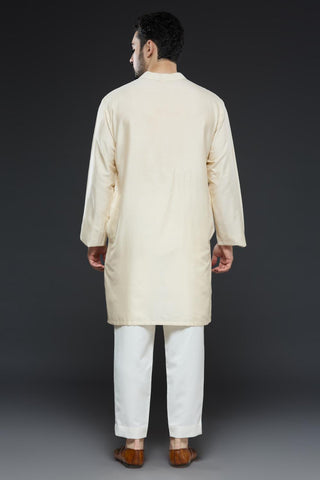 Ivory kurta and slim pant set paired with bright green long open jacket