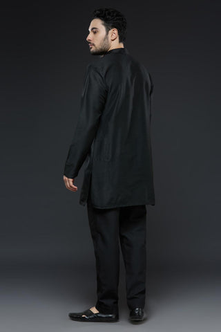 Black cotton silk kurta and slim pant set paired with black organza vest