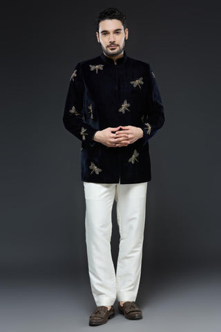 Midnight blue velvet jodhpur jacket with dragonfly embroidery and ivory pant set