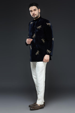 Midnight blue velvet jodhpur jacket with dragonfly embroidery and ivory pant set