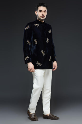 Midnight blue velvet jodhpur jacket with dragonfly embroidery and ivory pant set