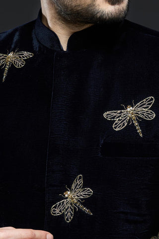 Midnight blue velvet jodhpur jacket with dragonfly embroidery and ivory pant set