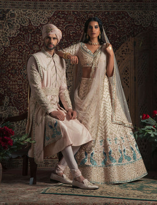 Powder peach peacock sherwani set