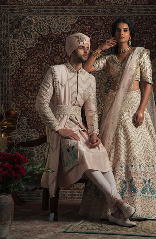 Powder peach peacock sherwani set