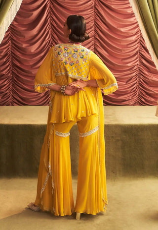 Jyoti yellow embellished peplum and gharara pants