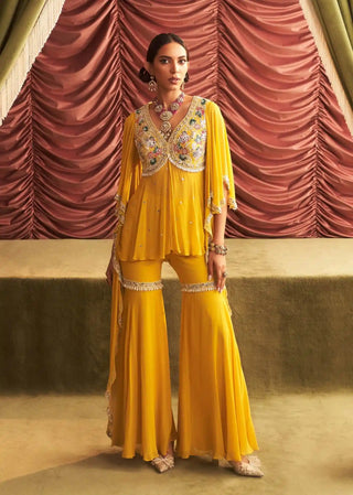 Jyoti yellow embellished peplum and gharara pants