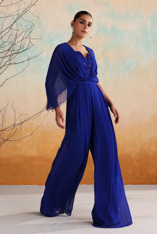 Electric blue pleated jumpsuit with embellished neckline