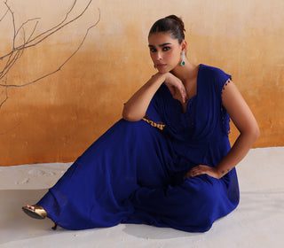 Electric blue pleated jumpsuit with embellished neckline