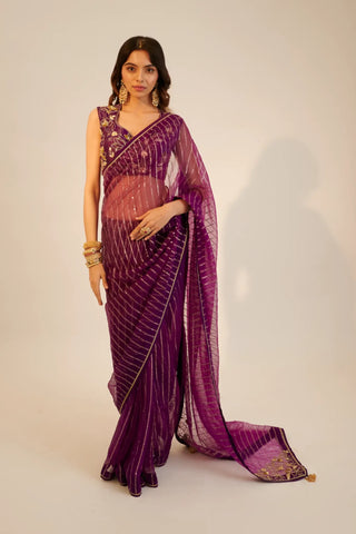 Purple embroidered organza saree paired with blouse