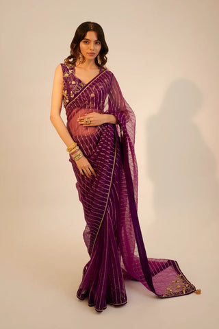 Purple embroidered organza saree paired with blouse