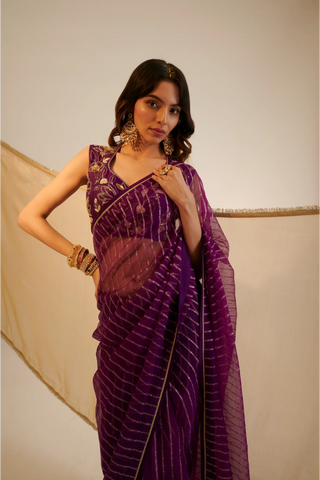 Purple embroidered organza saree paired with blouse