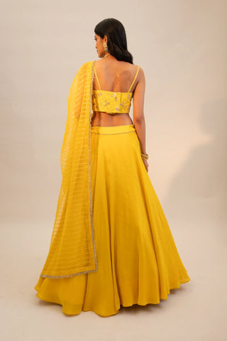 Yellow embroidered lehenga and blouse paired with dupatta