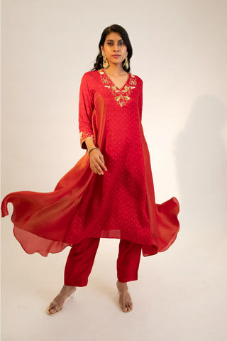 Red embroidered kurta paired with pants and dupatta