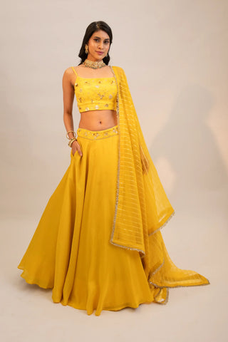 Yellow embroidered lehenga and blouse paired with dupatta