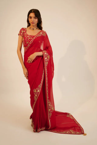 Red embroidered organza saree paired with blouse