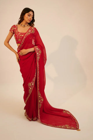 Red embroidered organza saree paired with blouse