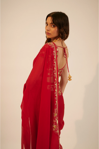 Red embroidered organza saree paired with blouse