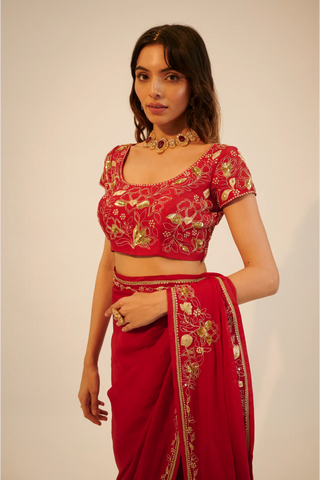 Red embroidered organza saree paired with blouse