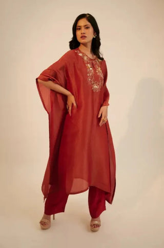 Red embroidered kaftan kurta paired with pants