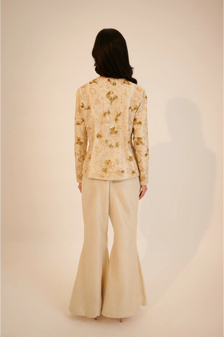 Ivory embroidered top paired with bell bottom pants