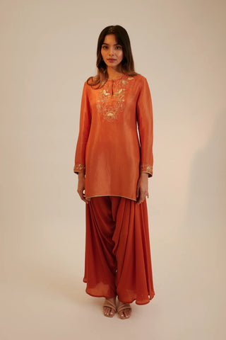 Rust embroidered short kurta paired with cowl pants