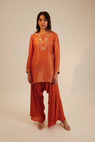 Rust embroidered short kurta paired with cowl pants