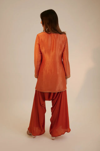 Rust embroidered short kurta paired with cowl pants