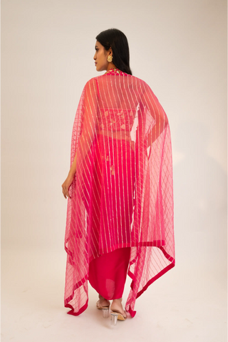 Pink embroidered blouse paired with slit skirt, belt and cape