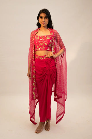 Pink embroidered blouse paired with slit skirt, belt and cape